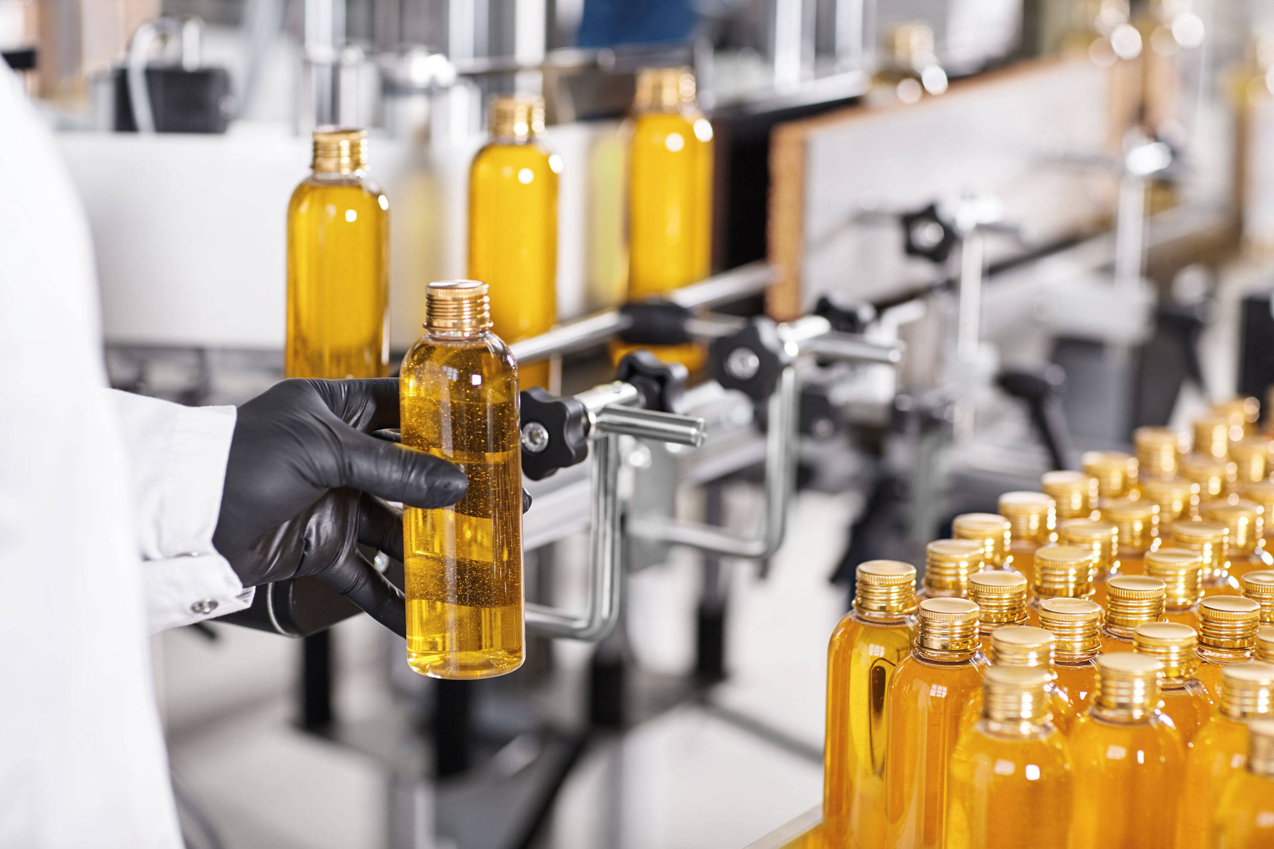 transparent plastic bottles filled with yellow substance (1)